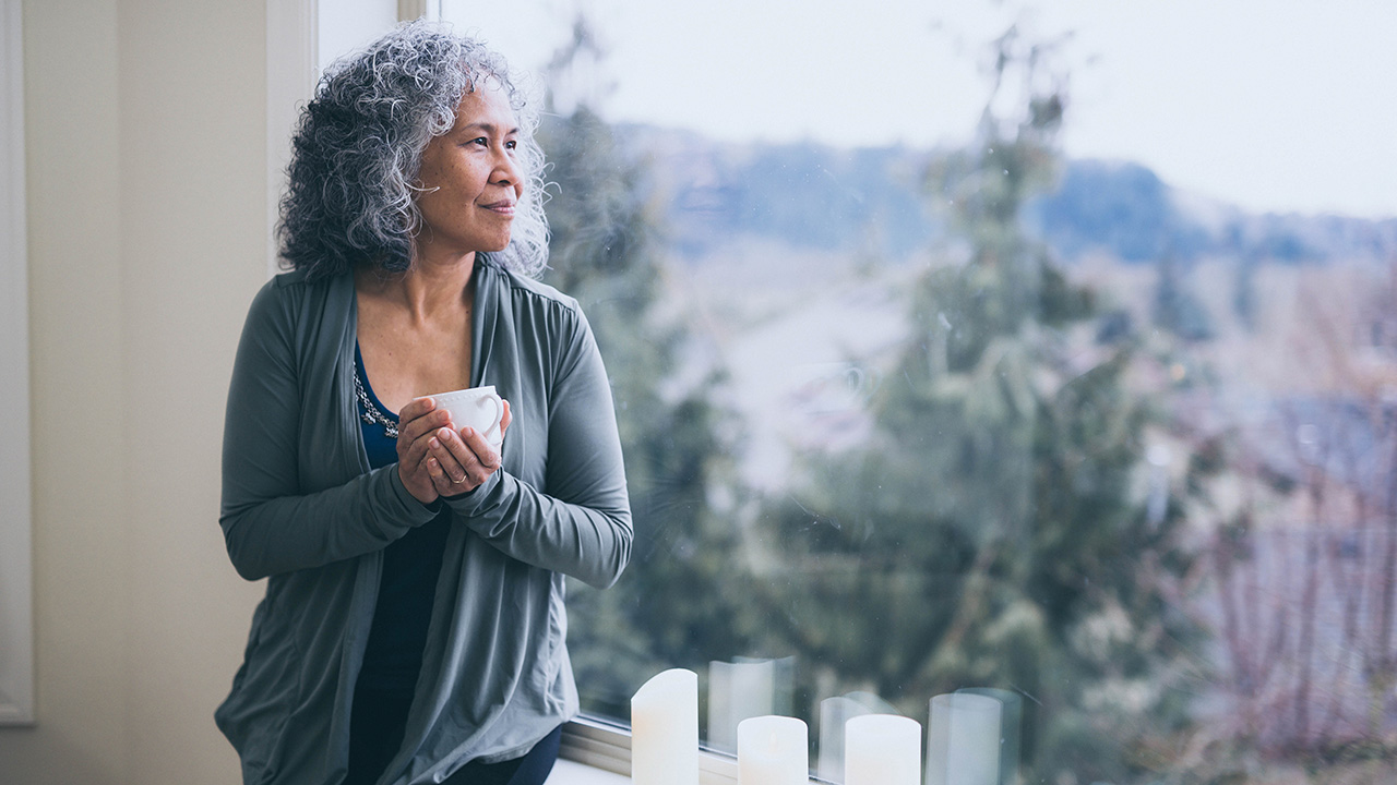 Elder woman having a cup of coffee
